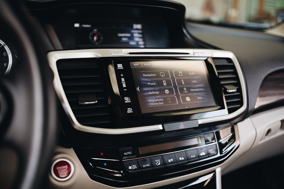 Close-up view of a modern car's infotainment display showing navigation and smartphone settings.